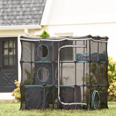 Kitty City Mega Catio Kit set up on a lawn